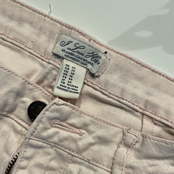 Pale pink jean shorts with small pocket details. Size 27. - Picture 3 of 3